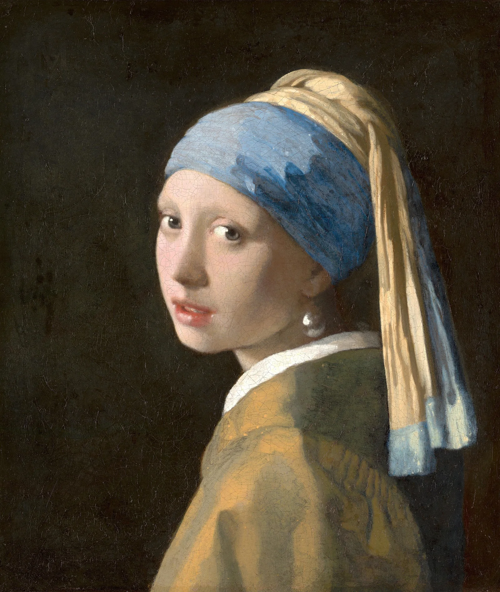 A girl in a blue and yellow turban looks back over her shoulder with parted lips, a large pearl at her ear, against a dark background